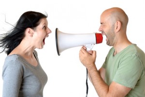 Man yelling at woman through megaphone