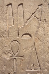 Egyptian bas relief with hieroglyphs posibly depicting aliens as gods directing the building of the pyramids