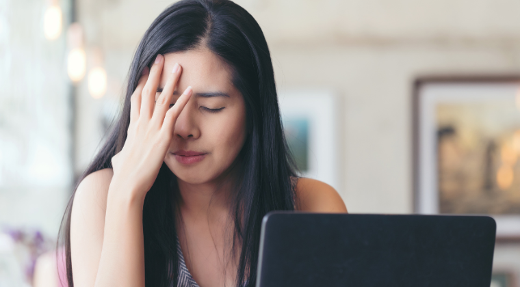 woman overwhelmed by business struggles