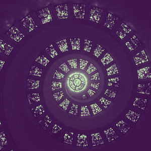 series of stained glass windows forming a spiral toward the center of the image